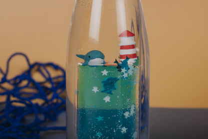 Petit Boum Bouteille sensorielle Move Baleine